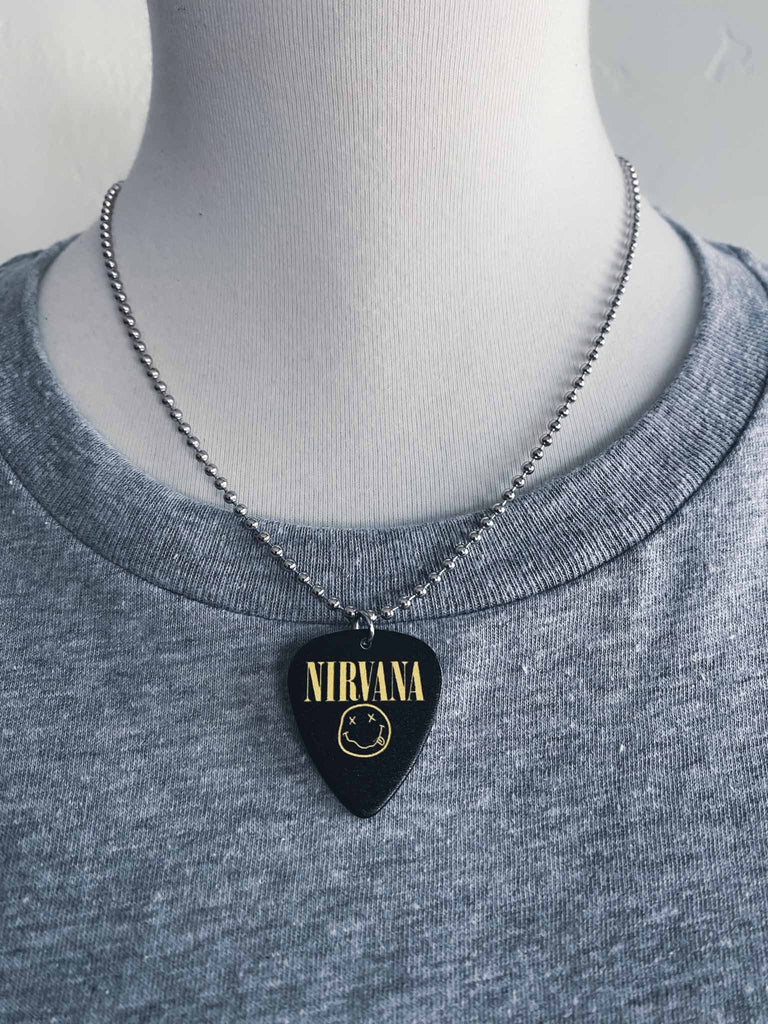 Nirvana Happy Face Guitar Pick Necklace | Black with yellow logo and happy face | Band merch | Rock & Roll Jane | Officially licensed band tees and band merch