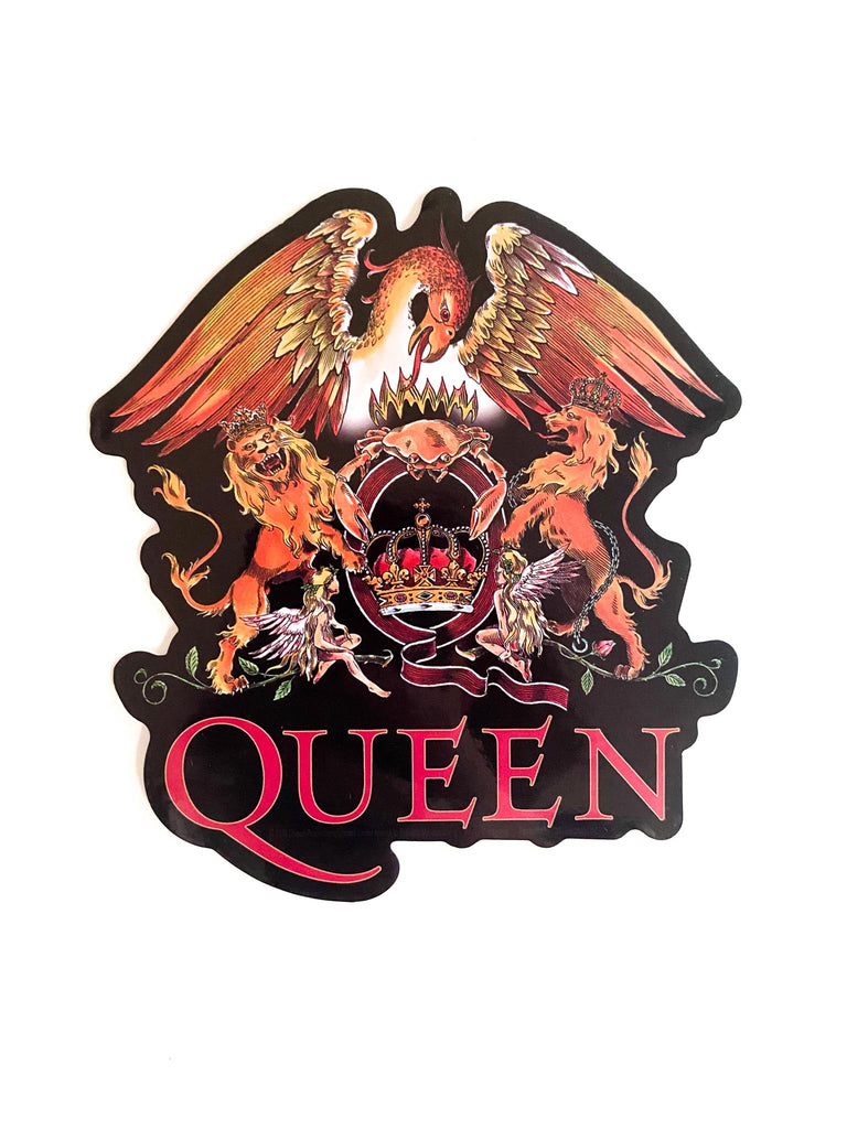 Sticker with 'QUEEN' and emblem design held by a hand on a white background. Officially licensed QUEEN classic crest sticker available at Rock & Roll Jane.