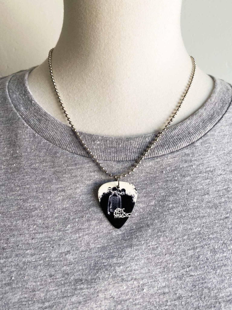 Arctic Monkey Guitar Pick Necklace | 18" stainless steel ball chain | Fast shipping | Shop officially licensed band tees and more at Rock & Roll Jane