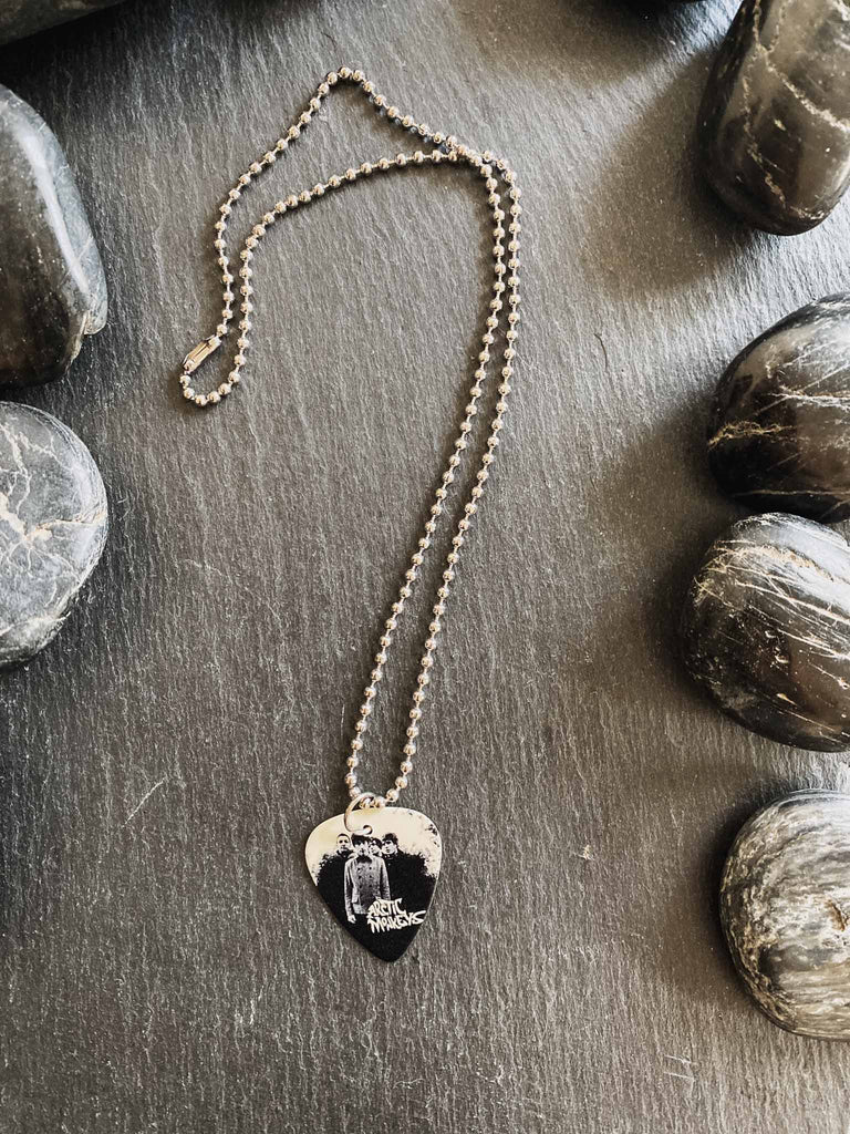 Arctic Monkey Guitar Pick Necklace | 18" stainless steel ball chain | Fast shipping | Shop officially licensed band tees and more at Rock & Roll Jane