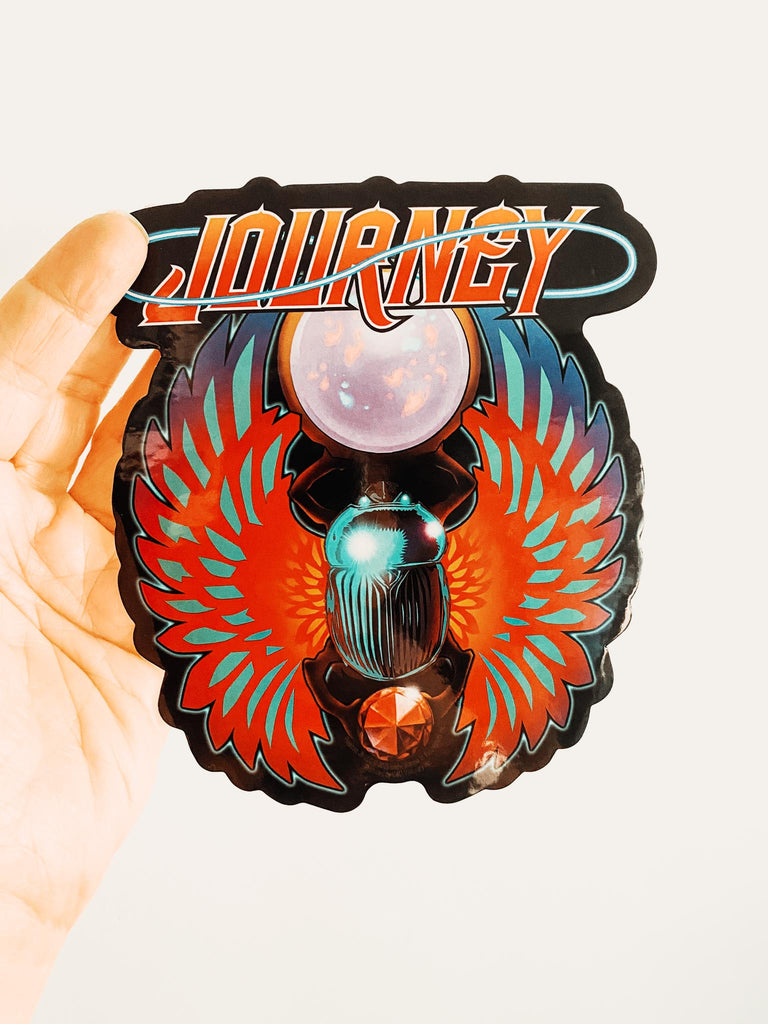 Colorful 'Journey' logo with a central figure on a white background. Available at Rock & Roll Jane.