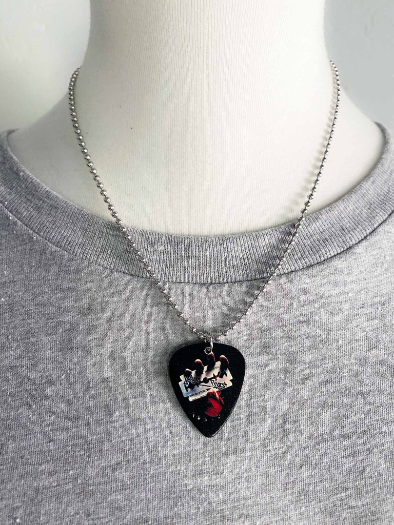 Judas Priest guitar pick necklace featuring the artwork from the album, "British Steel." | 18" silver ball chain plus extra cord for versatility | Shop official band tees and merch at Rock & Roll Jane | Fast shipping