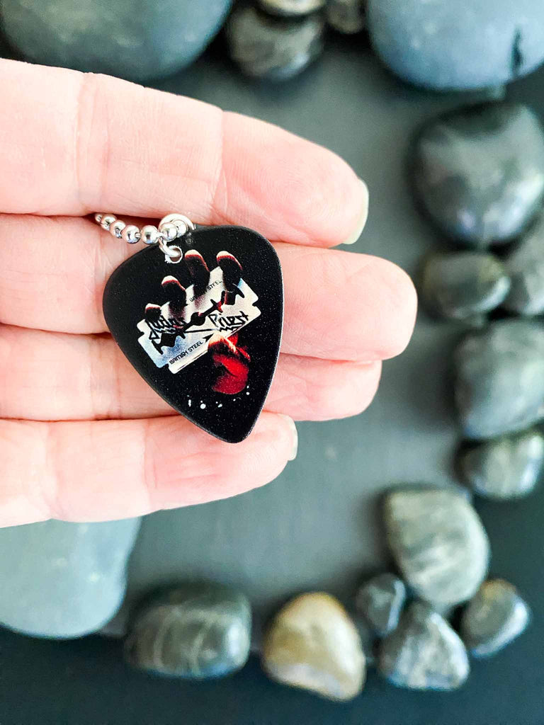 Judas Priest guitar pick necklace featuring the artwork from the album, "British Steel." | 18" silver ball chain plus extra cord for versatility | Shop official band tees and merch at Rock & Roll Jane | Fast shipping