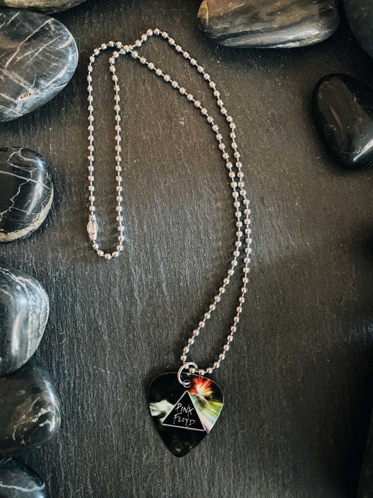 Pink Floyd guitar pick necklace made of stainless steel ball chain. The guitar pick features the Dark Side of the Moon prism and rainbow artwork. 