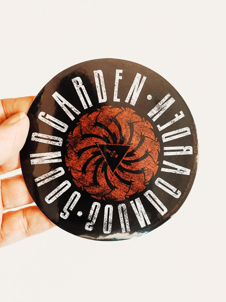 Round sticker with 'Soundgarden' logo on a white background. Badmotorfinger album. Official merch available at Rock & Roll Jane.