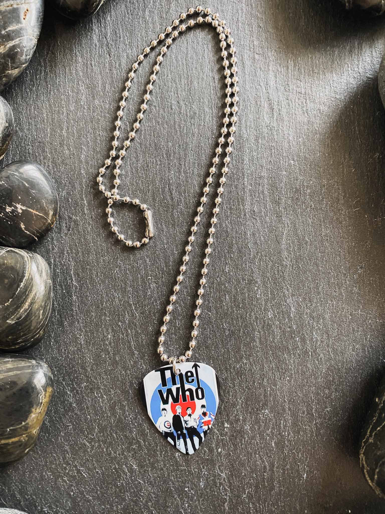 The Who guitar pick necklace featuring the band's logo and photo | 18" silver ball chain and comes with an extra black cord | Available at Rock & Roll Jane | We carry officially licensed band tees and accessories