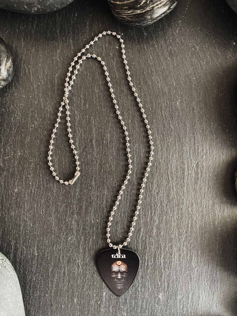 Tool guitar pick necklace | 18" silver ball chain with design on both front and back | band merch | Available at Rock & Roll Jane